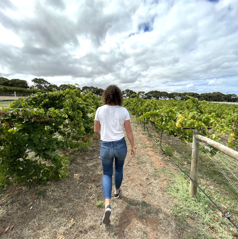 Girl walking in vineyards Boston Bay Wines Port Lincoln